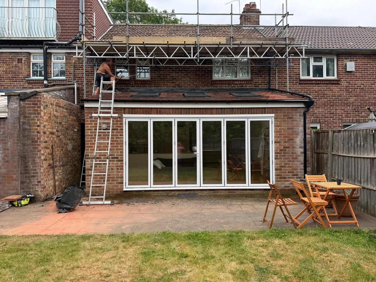 extension with ladder on left side and 6 pane window
